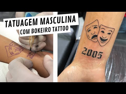 Qual é o significado da tatuagem de cara triste e feliz?